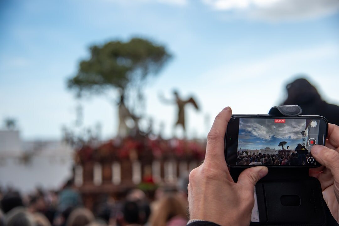 Camera operator filming a live outdoor broadcast event