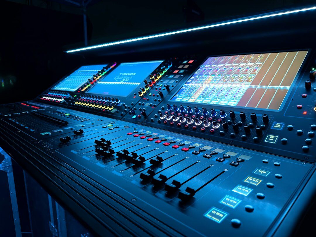 Broadcast control room with operators monitoring live video feeds